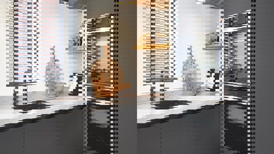 Zwarte Fenix keuken met grijs blad